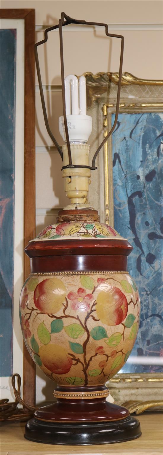 A Victorian floral and fruit painted pottery table lamp